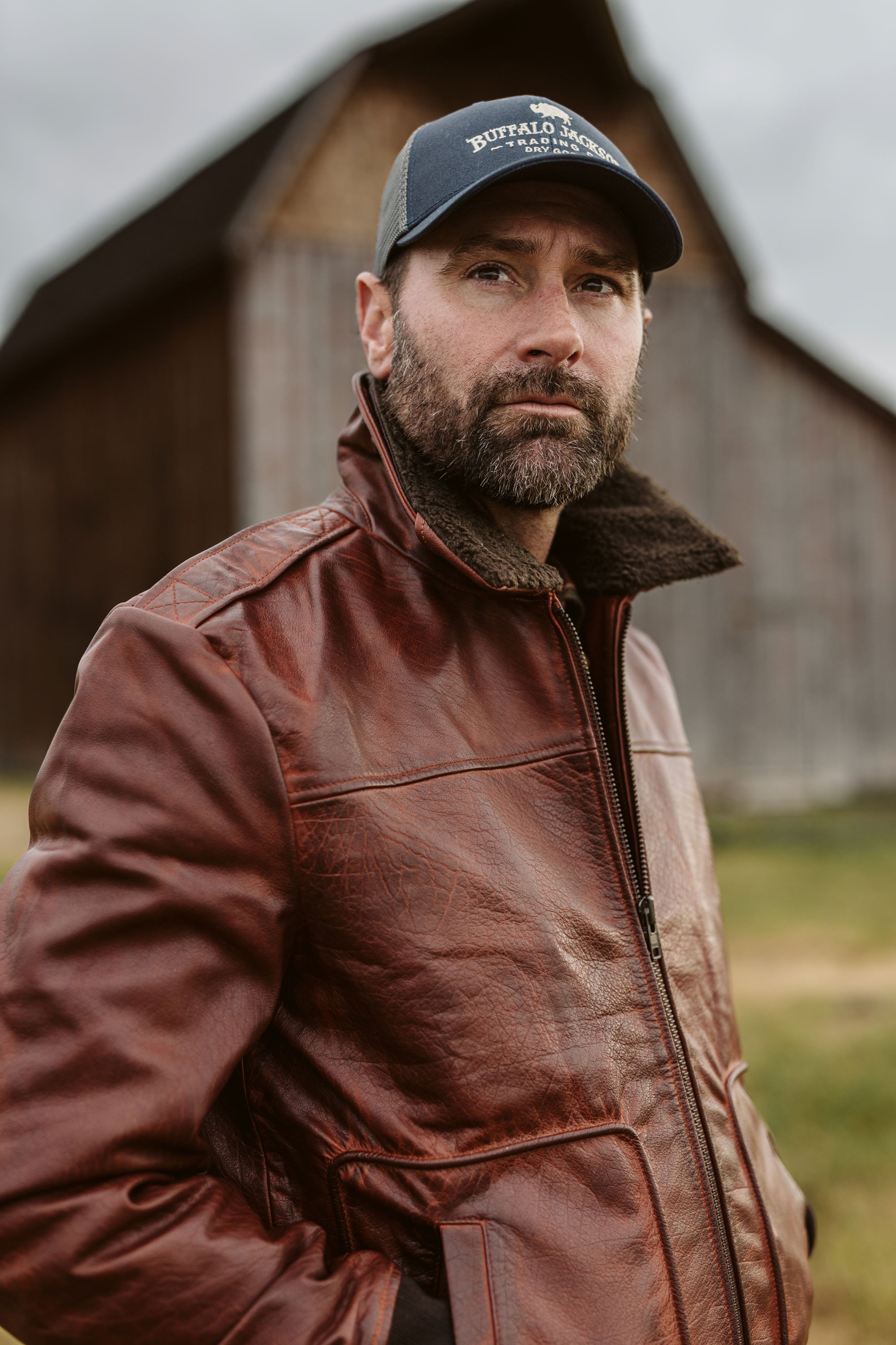 Buffalo Grain Brown Maverick leather bomber jacket flat lay showing full front, sherpa collar, and YKK zipper closure.