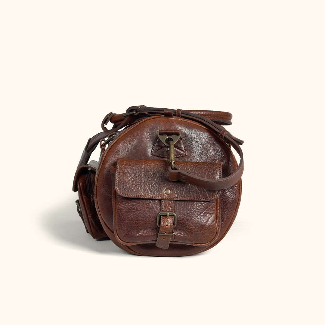 Side View - Adjustable Strap, Removable Strap, and Side Flap Pocket with Buckle Enclosure for Buffalo Grain Duffle Bag