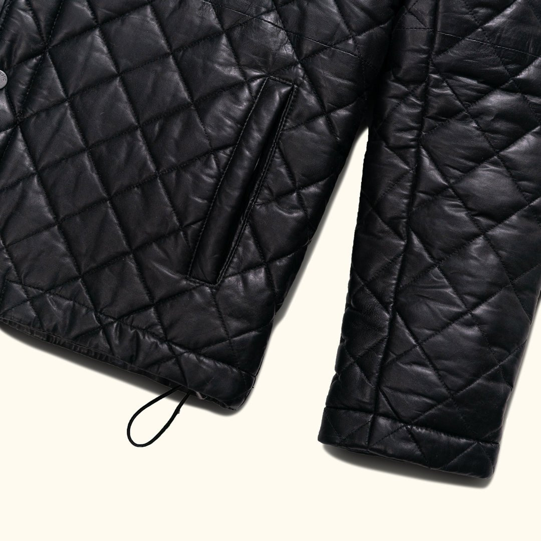 The high collar adds an extra layer of protection against the elements while maintaining a sharp and polished look.