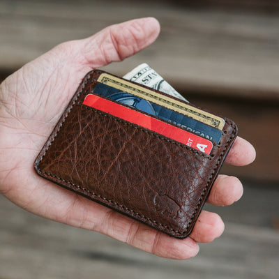 Interior view of Roosevelt slim leather wallet showing three credit card slots and full-length cash compartment, holds up to 3 per slot for 9 total