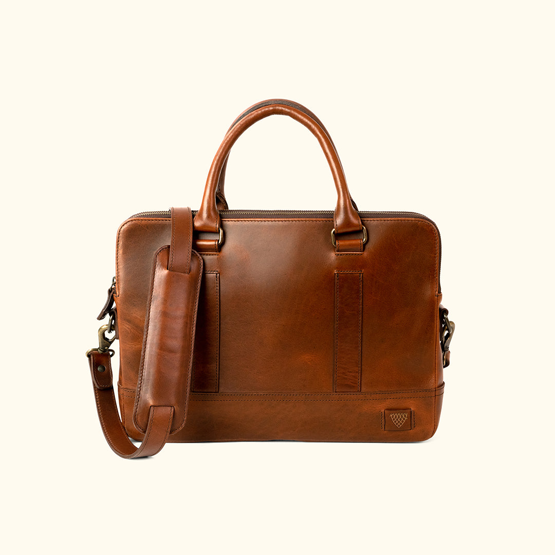 Sleek brown leather attaché briefcase with dual top handles and adjustable shoulder strap — Jefferson Collection, Elderwood Brown.