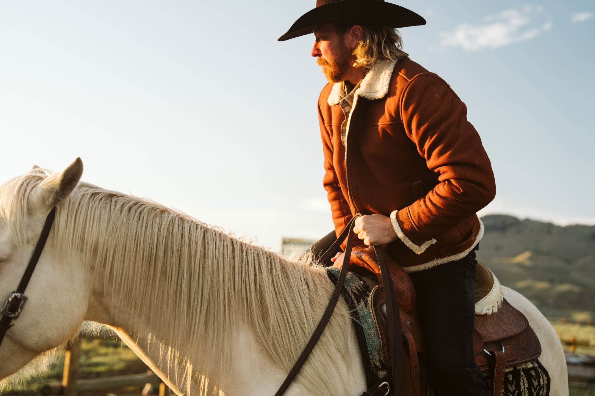 Rancher on horseback wearing a shearling leather jacket with a wool collar