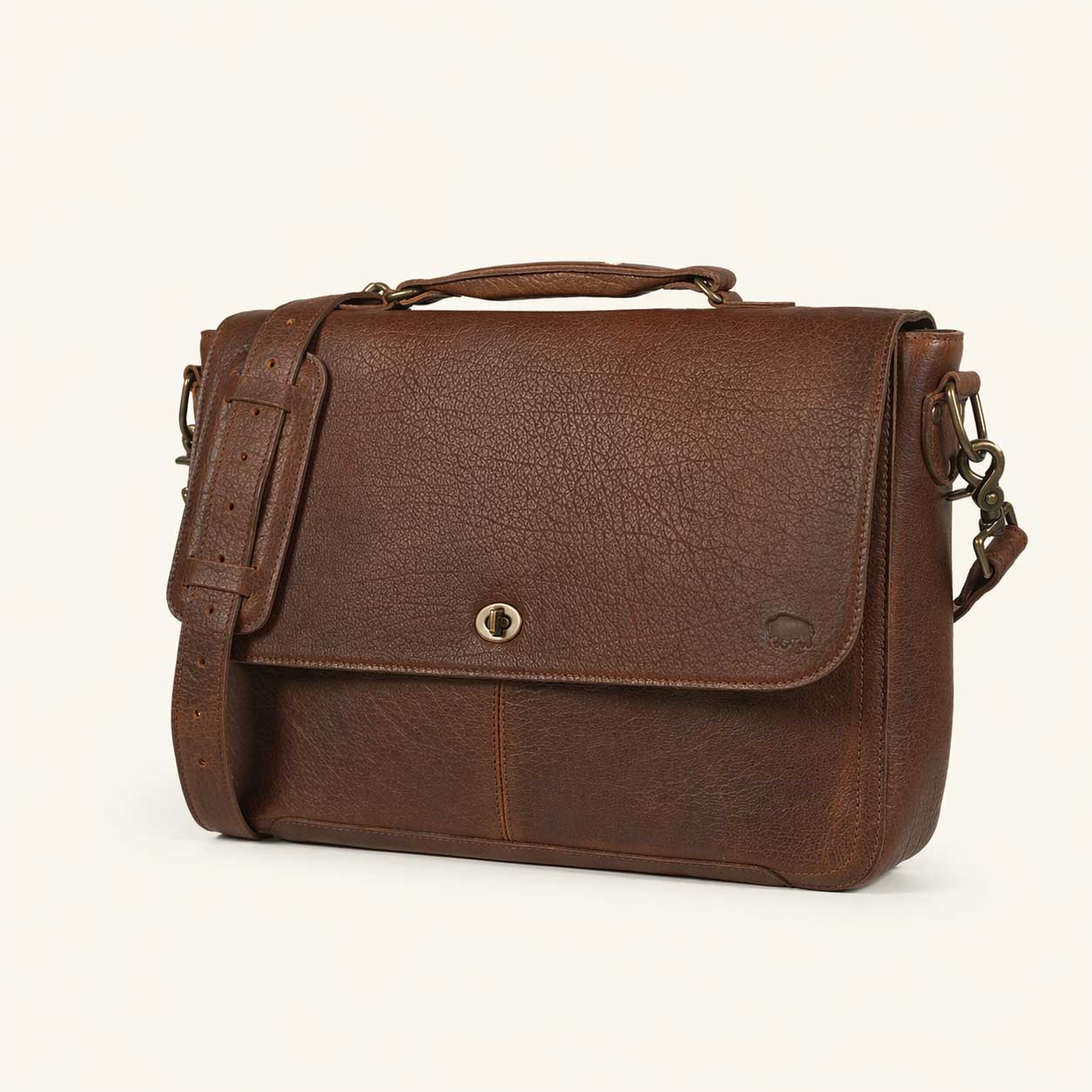 Roosevelt Leather Laptop Messenger Bag in Buffalo Grain brown — full-grain leather flap with turn-lock closure and adjustable strap