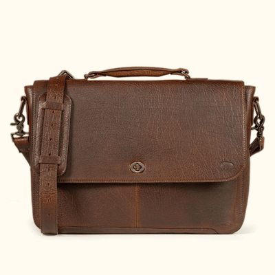 Roosevelt Messenger Bag holding a 13", 14" or 115" laptop in the padded interior sleeve — full-grain Buffalo Grain leather