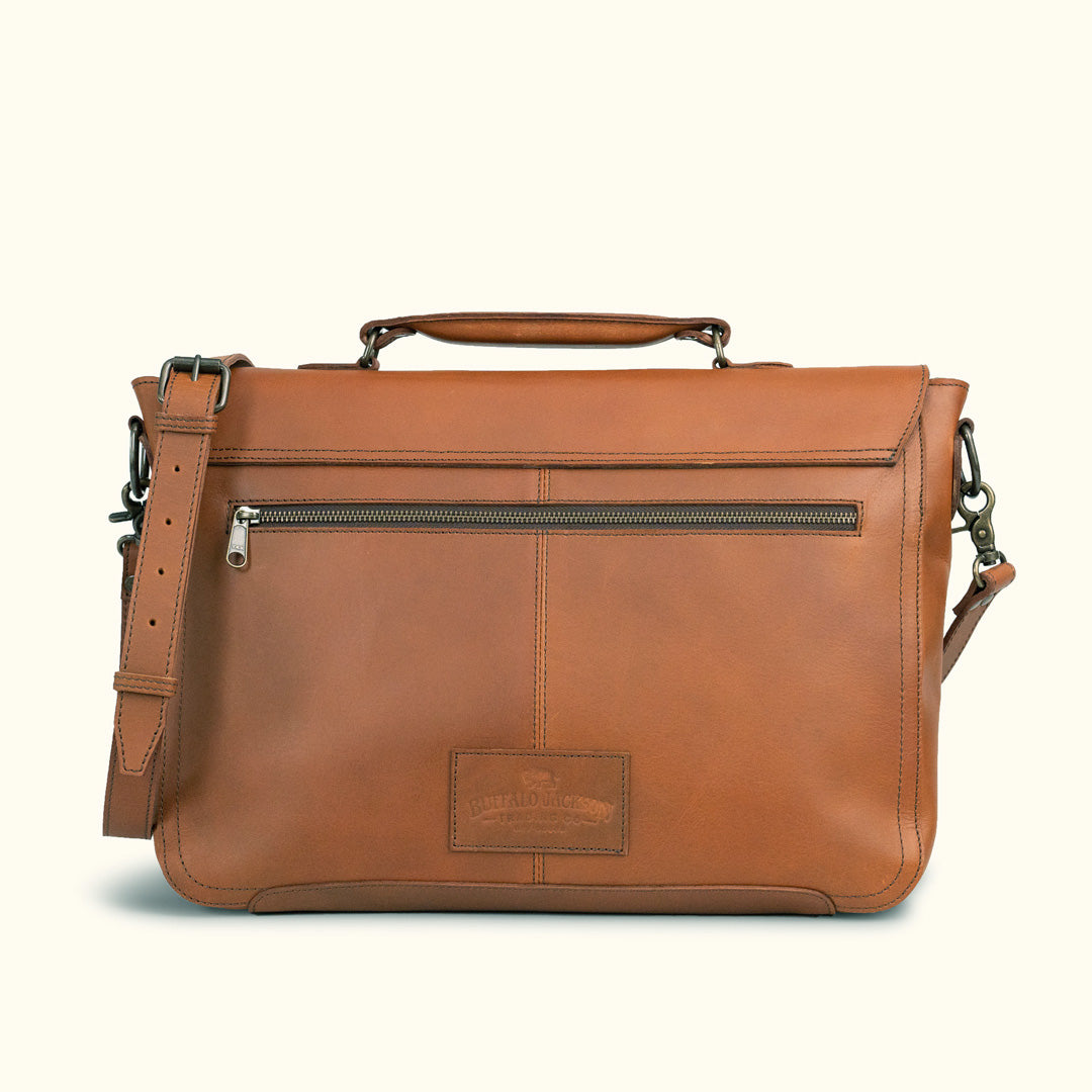 Brown leather shoulder bag with a minimalist design, featuring a large main compartment and easy-access front pocket for essentials.