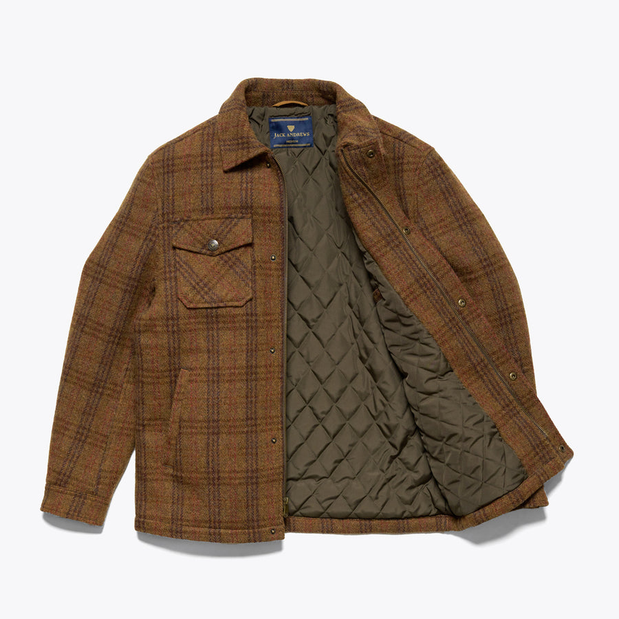A brown checkered wool jacket with a quilted polyester lining, featuring snap-button front chest pockets and a dual zipper and button-snap closure.