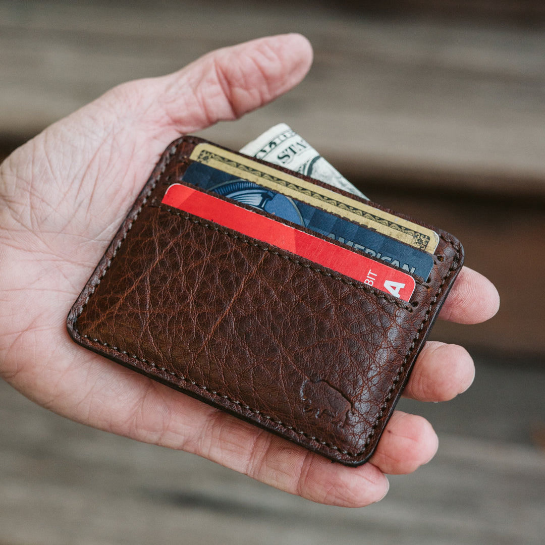 Interior view of Roosevelt slim leather wallet showing three credit card slots and full-length cash compartment, holds up to 3 per slot for 9 total