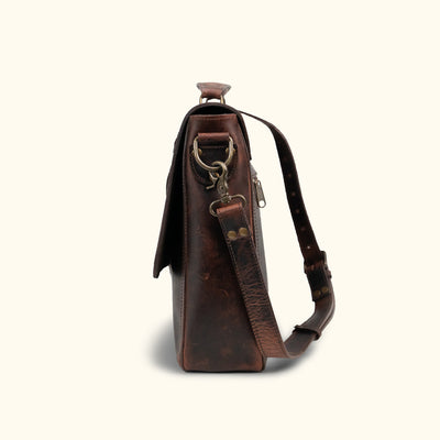 Roosevelt Messenger Bag side angle — Dark Oak full-grain leather, adjustable shoulder strap, multiple storage compartments