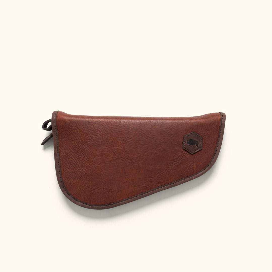 Dakota Handgun and Pistol Case in vegetable-tanned brown leather with antique brass zipper and Buffalo Jackson leather patch