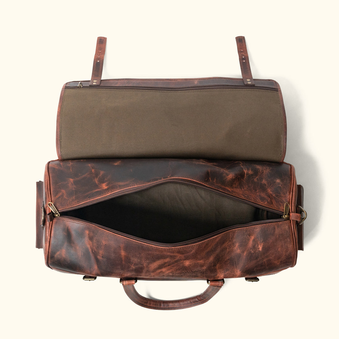 Versatile dark oak leather travel duffle featuring external pockets, adjustable straps, and a spacious interior for essentials.