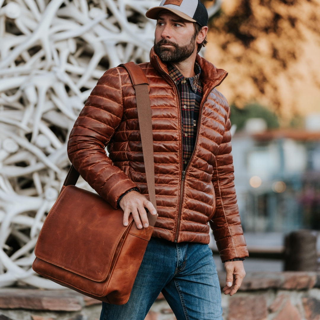 Roosevelt Buffalo Leather Satchel Messenger Bag | Amber Brown in the mountains in Yellowstone